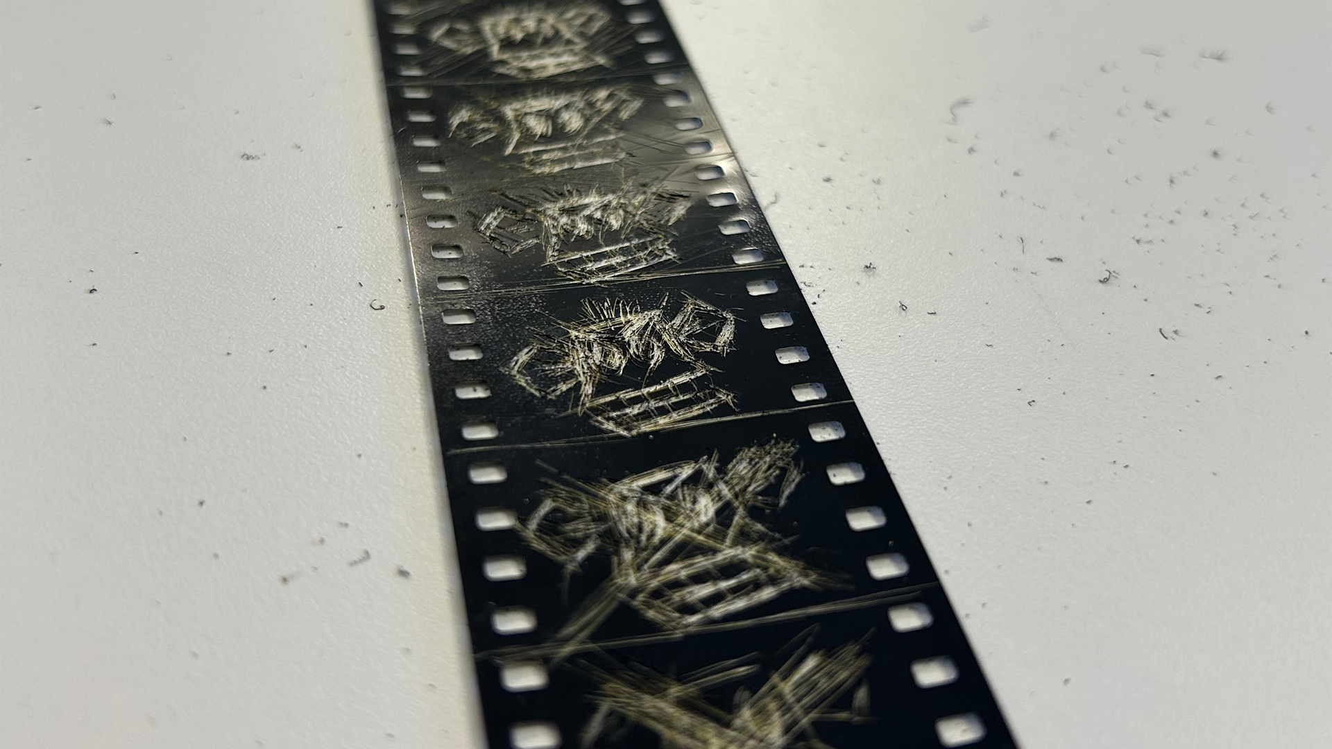 Scratching on film