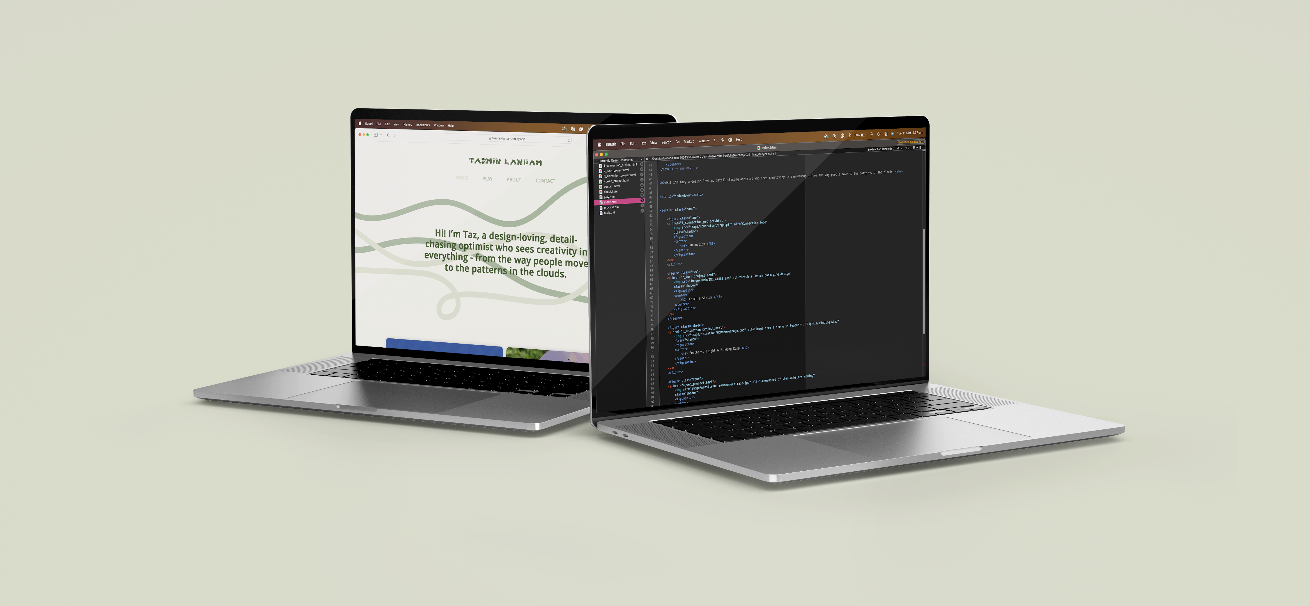 Image of a laptop with my website and code on the screen